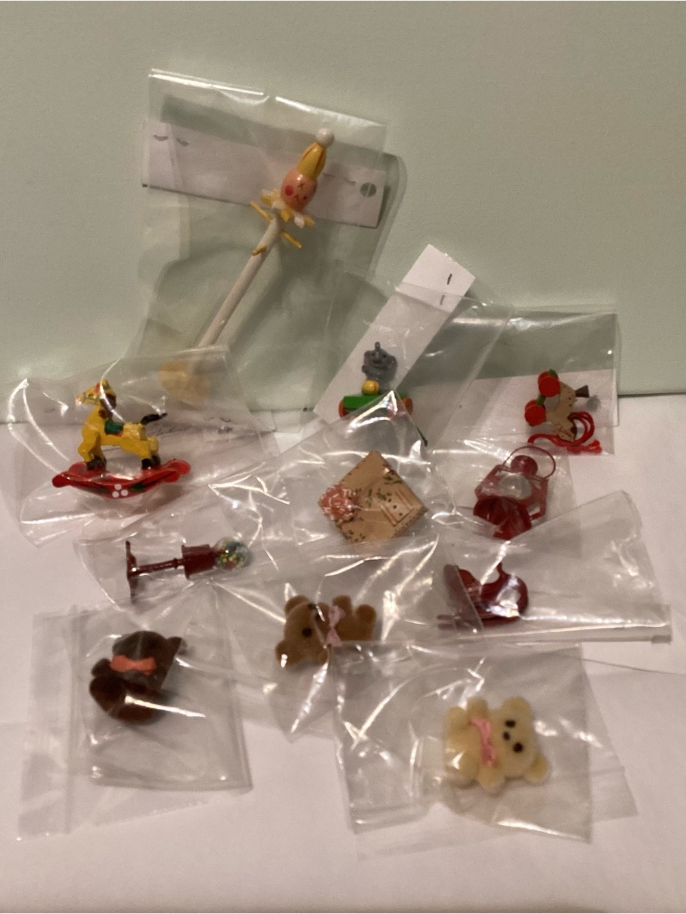 Lot of eleven doll house miniature accessories including three flocked bears